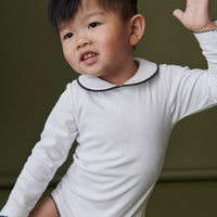baby lirio onesie white