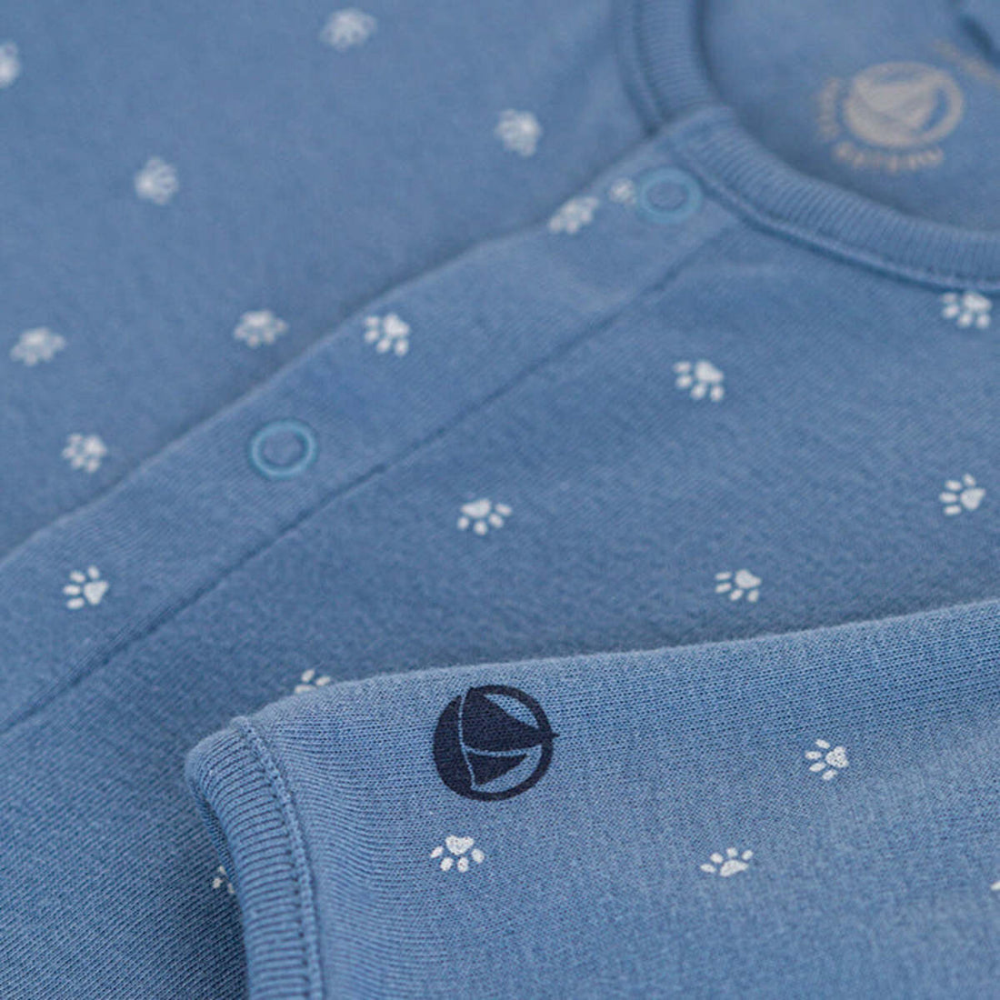 front snap paw print footie